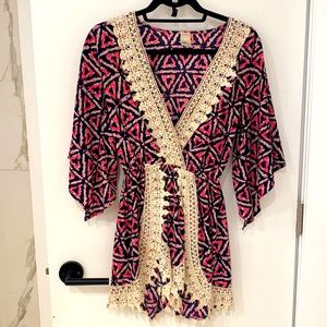 Black/Pink/Blue patterned romper with lace. Size Small. Worn once.